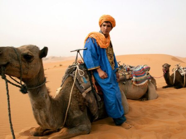 Desert man in Merzouga with camel